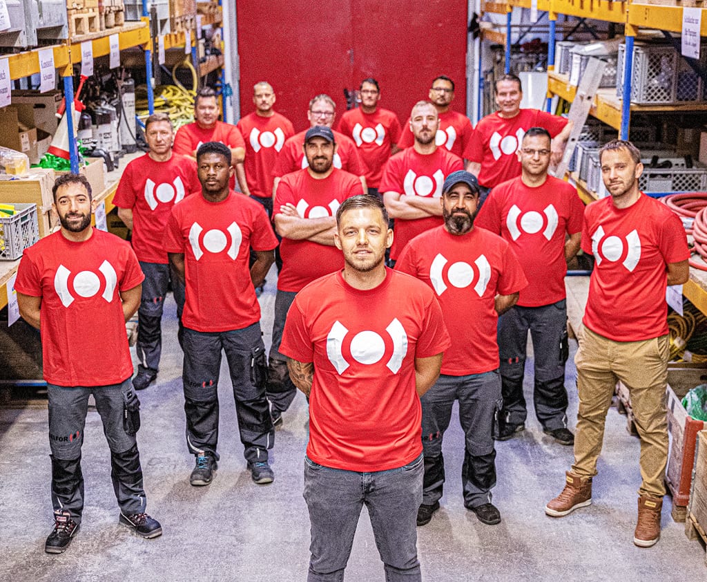 A male BELFOR team in a warehouse
