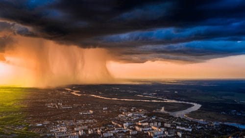A storm slowly approaching a city