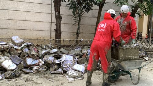 BELFOR Employees cleaning after a flood